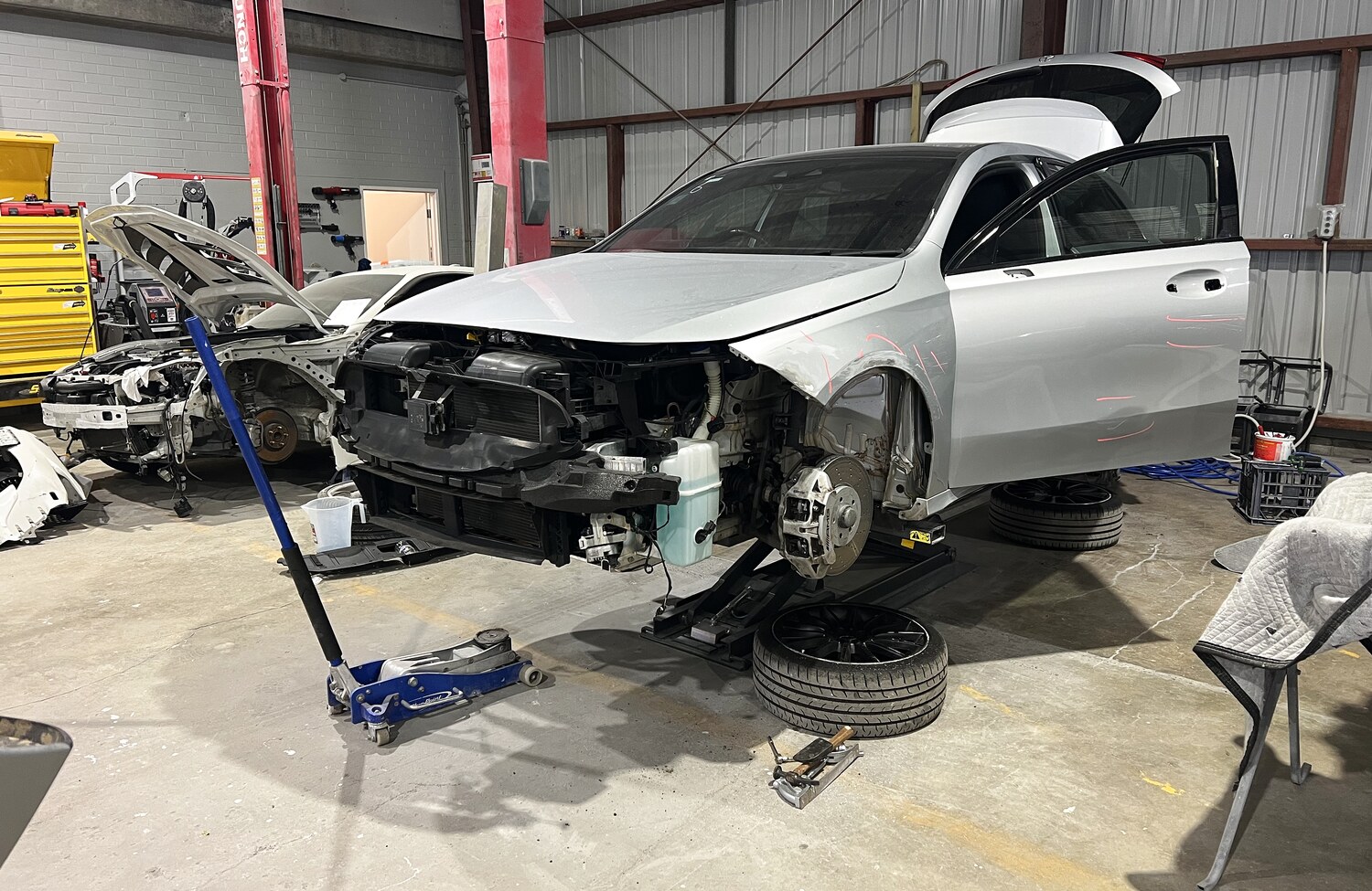 Mercedes-AMG stripped for front-end panel repair at All Gosford Smash Repairs