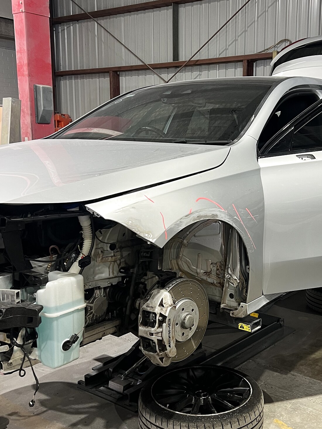 Mercedes-AMG with front guard removed and AMG brakes exposed, mid-repair at All Gosford Smash Repairs